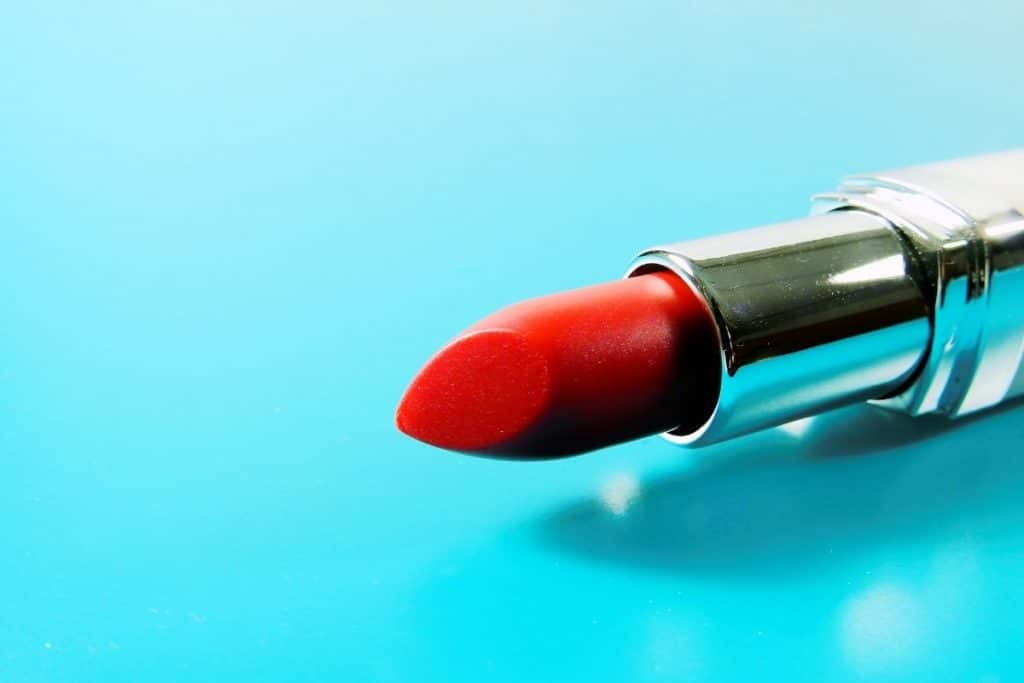 Red lipstick with a blue background