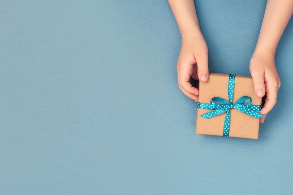Blue background with a paper present